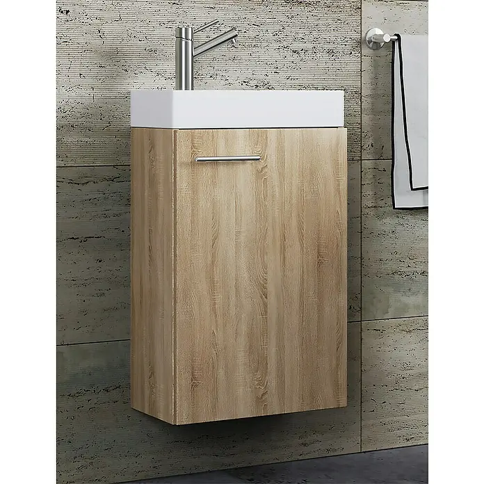 VCM Badmöbel-Set Slito - Gesamtbreite Badmöbel: 40,5 cm, Sonoma-Eiche, Matt, 2 -tlg. - Ein moderner Waschtisch mit Holzmaserung und weißem Aufsatzwaschbecken. Der Waschtisch hängt an einer gemusterten Wand.
