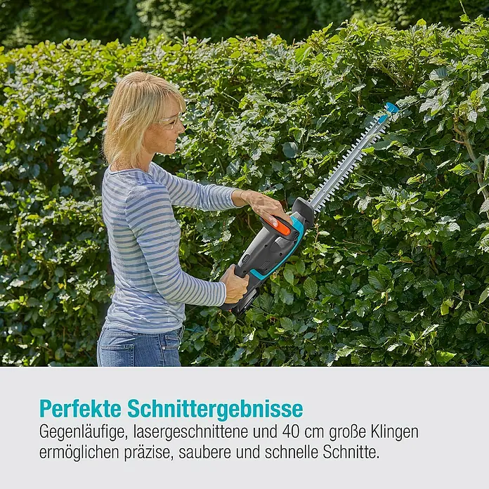 Gardena Power for All 18V Akku-Heckenschere EasyCut - 18 V, Li-Ionen, Ohne Akku - Frau schneidet Hecke mit Gardena Heckenschere, die für präzise und saubere Schnitte sorgt.