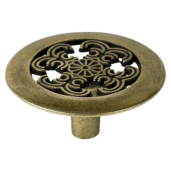 Nesu Pomo para muebles Cuero Viejo - Ø x Al: 37 x 17 mm, Cuero envejecido, 1 ud. - Tirador de cajón de bronce antiguo con un intrincado diseño floral calado sobre una base redonda, ideal para muebles.