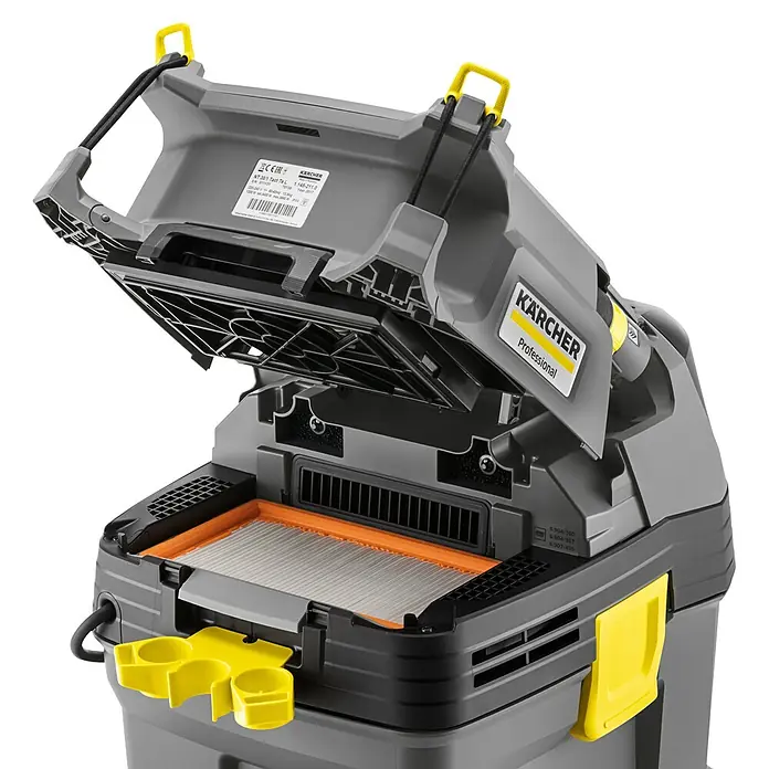 Kärcher Aspirador en seco y húmedo eléctrico NT 30/1 TACT L - 1.380 W, Volumen de recipiente: 30 l, Con bolsa - Primer plano de una aspiradora Kärcher Professional con el compartimento del filtro abierto, mostrando el filtro y el interior.