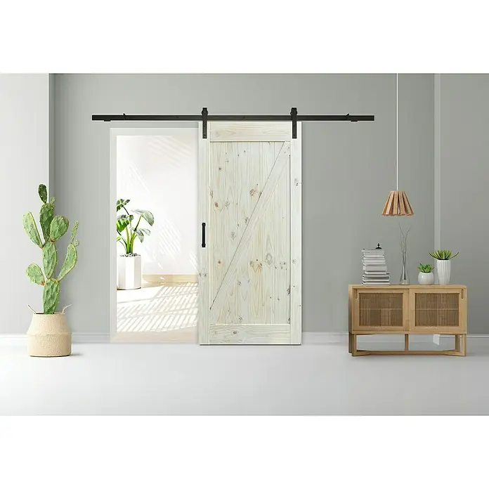 Puerta corredera de madera Dixie - An x Al: 75 x 210 cm - Una puerta de granero de madera parcialmente abierta con herrajes sobre una pared gris.