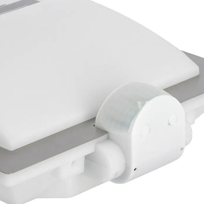 Steinel Sensor-Außenleuchte L 20 S Edelstahl - 60 W, 8 x 24 x 23 cm, Weiß/Silber, IP44 - Nahaufnahme eines weißen Bewegungsmelders mit einem grauen Sensor, der an einer weißen Oberfläche befestigt ist.