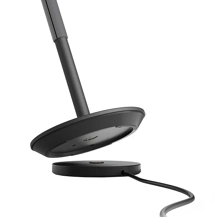 Philips Hue Akku-Tischleuchte Go Portable - 6,2 W, L x B x H: 21,9 x 20,9 x 38,8 cm, Mehrfarbig, Schwarz - Bild einer Lampe, die auseinandergenommen wurde und die Basis für die Stromzufuhr freilegt.
