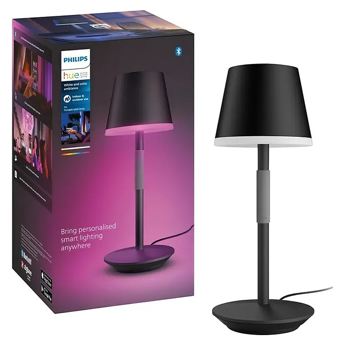 Philips Hue Akku-Tischleuchte Go Portable - 6,2 W, L x B x H: 21,9 x 20,9 x 38,8 cm, Mehrfarbig, Schwarz - Abbildung einer Philips Hue Go tragbaren Tischleuchte in Schwarz, zusammen mit der zugehörigen Produktverpackung.