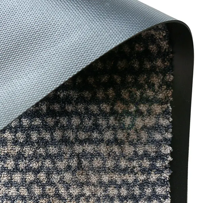 SCHÖNER WOHNEN-Kollektion Fußmatte Punkte - Anthrazit/Braun, 50 x 70 cm - Nahaufnahme einer Fußmatte mit einer robusten Unterseite und einem strukturierten Oberflächenmuster in Grau- und Beigetönen.