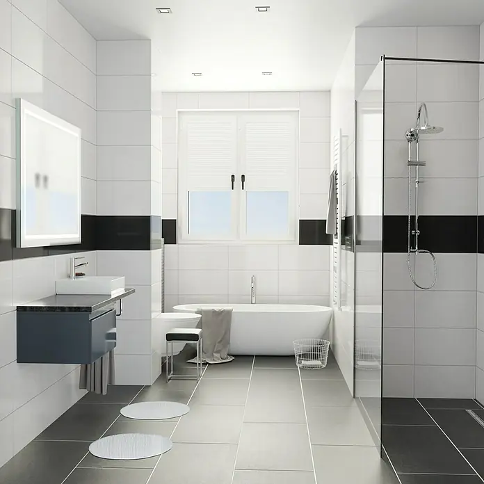Camargue Espacio Badmöbel-Set K25 - 120 cm, Gama anthrazit glänzend - Helles Badezimmer mit weißen Fliesen und schwarzen Akzenten. Ein modernes Waschbecken und eine freistehende Badewanne sind vorhanden.