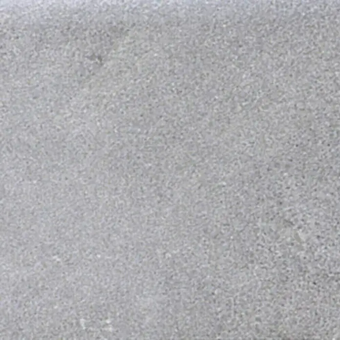Justus Kaminofen Usedom 7 - 7 kW, Raumheizvermögen: 144 m³, Material Verkleidung: Speckstein, Gussgrau/Speckstein - Nahaufnahme einer grauen Betonoberfläche, ideal für Hintergründe und Texturen, die eine schlichte, moderne Ästhetik suchen.