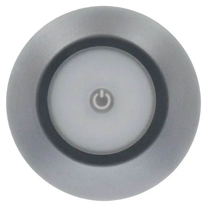 Lavida Akku-Tischleuchte Silea - 3,3 W, Anthrazit, Lichtfarbe: RGBW - Nahaufnahme einer runden, silberfarbenen Puck-Leuchte mit einem Power-Symbol in der Mitte, ideal für die Beleuchtung dunkler Bereiche.