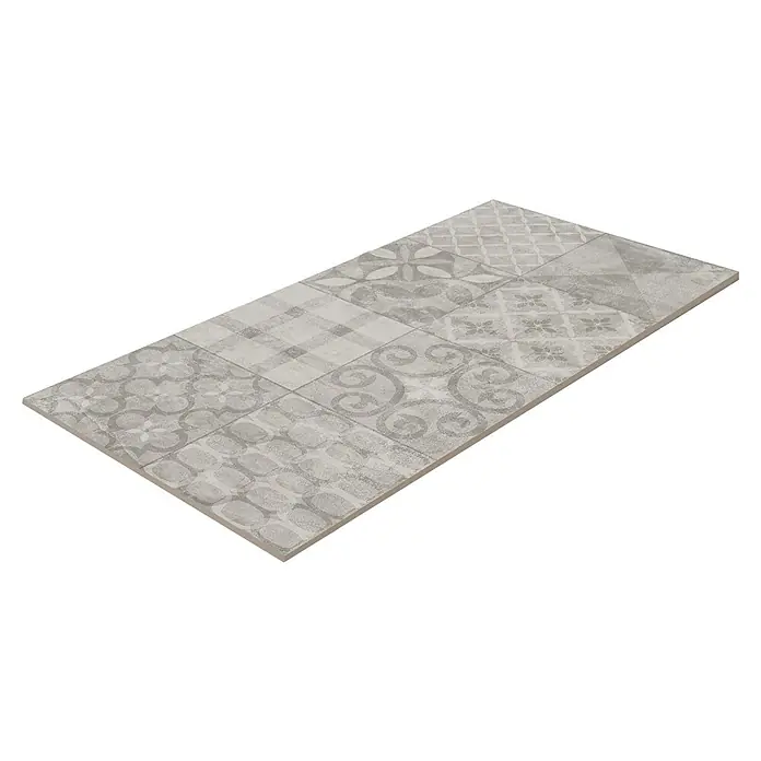 Feinsteinzeugfliese Dekorfliese Twin - 30 x 60 cm, Anthrazit, Matt - Nahaufnahme einer Keramikfliese mit einem Patchwork-Design aus verschiedenen grauen Mustern, ideal für stilvolle Innenräume.