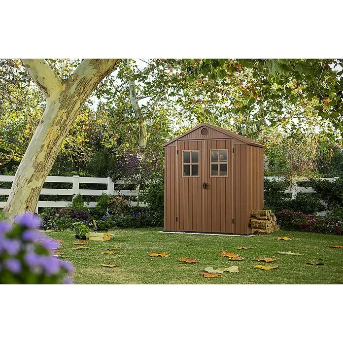 Keter Caseta de jardín Darwin 6X4 II - Medidas ext. (An x Pr): 190 x 121 cm, Plástico, Marrón, 2,3 m² - Idilio de jardín con caseta de jardín marrón.