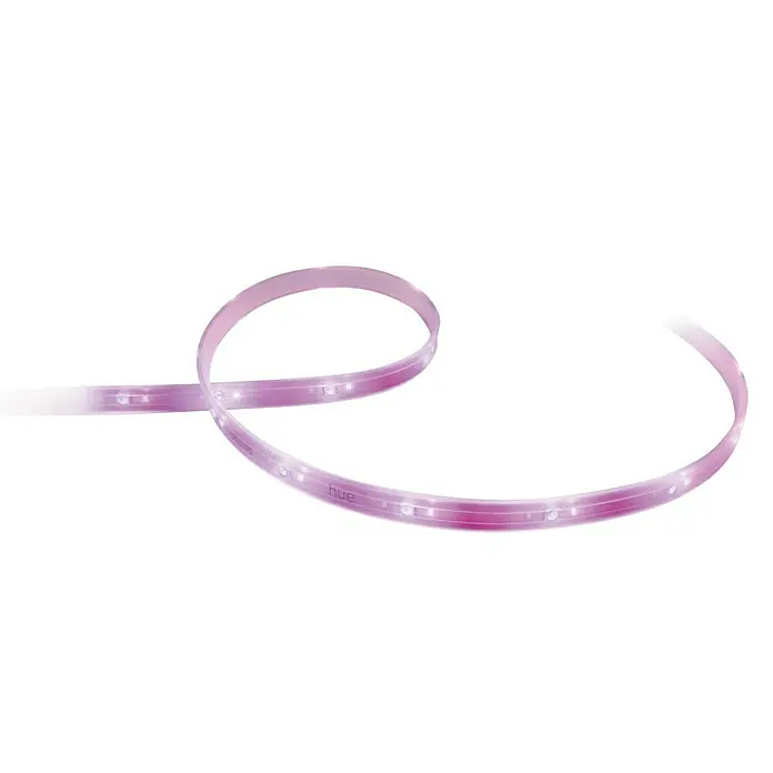 Philips Hue LED-Band Plus Erweiterung - 1 m, RGBW - Nahaufnahme eines gewundenen, pinkfarbenen Philips Hue Lightstrip Plus mit LED-Leuchten vor einem schwarzen Hintergrund.
