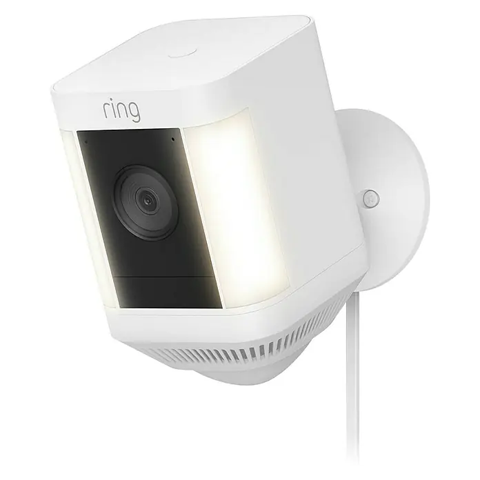Ring Überwachungskamera Spotlight Cam Plus Plugin - Netzbetrieben, 1.080 Pixel (Full HD), Weiß, B x H: 7,6 x 12,6 cm, Netzanschluss - Nahaufnahme einer weißen Ring Spotlight Cam, einer Sicherheitskamera für den Außenbereich mit integrierten Lichtern, auf schwarzem Hintergrund.