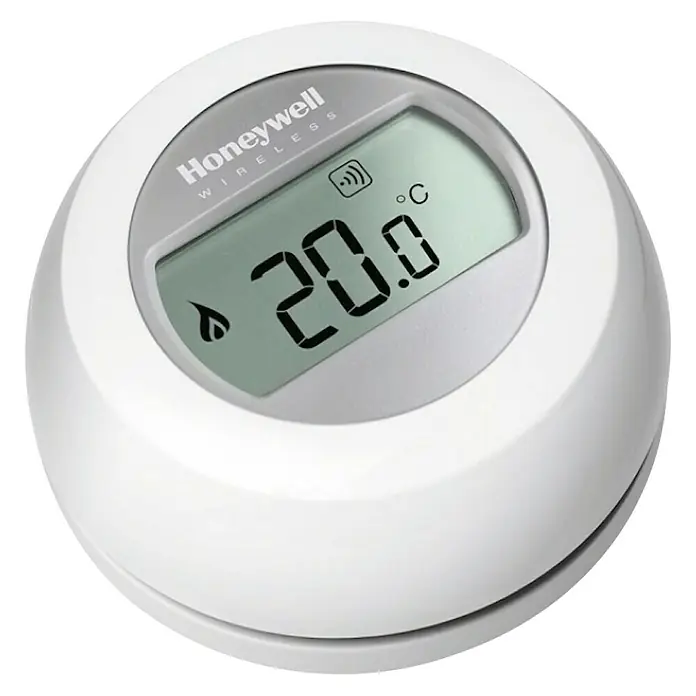 Honeywell Termostato digital redondo - Regulador de temperatura - Un termostato Honeywell Wireless redondo y blanco con una pantalla digital que muestra 20.0 °C.