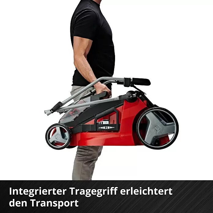 Einhell PXC 18V Cortacésped de batería GE-CM 43 Li M Kit - 18 V, 2 baterías, 4 Ah, Ancho de corte: 43 cm - Un hombre lleva una cortadora de césped roja y negra plegada por su asa integrada, lo que demuestra un transporte fácil.