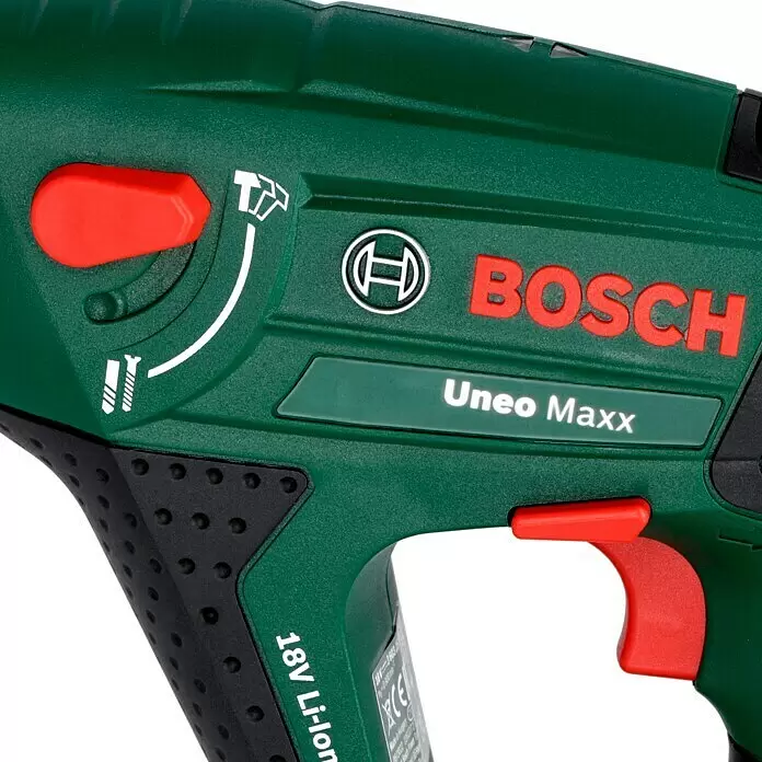 Bosch Power for All 18V Akku-Bohrhammer Uneo Maxx - 18 V, 2 Akkus, 0,6 J - Grünes Bosch Uneo Maxx 18V Li-Ion Elektrowerkzeug mit roten Knöpfen und schwarzem Griff, zeigt Moduswähler.