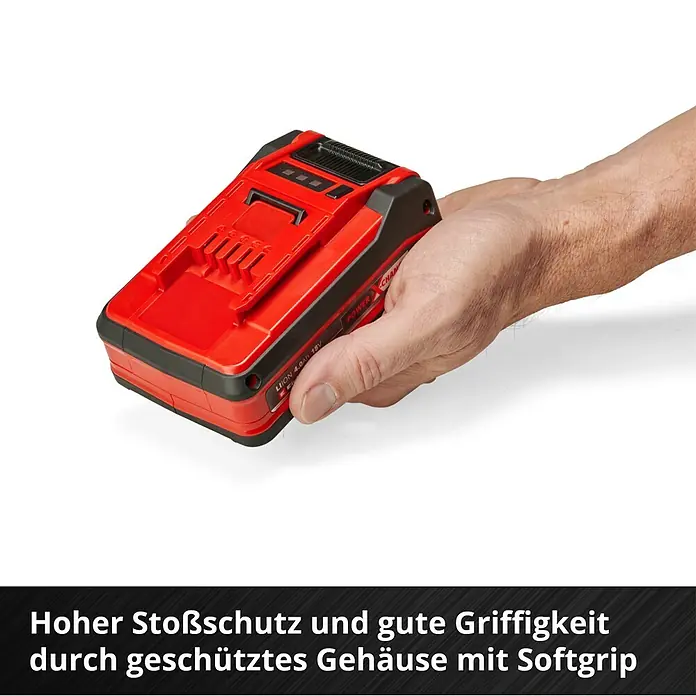 Einhell Power X-Change 18V Akku - 18 V, 4 Ah - Abgebildet ist ein roter Akku mit Softgrip in einer Hand, der hohen Stoßschutz und gute Griffigkeit bietet.