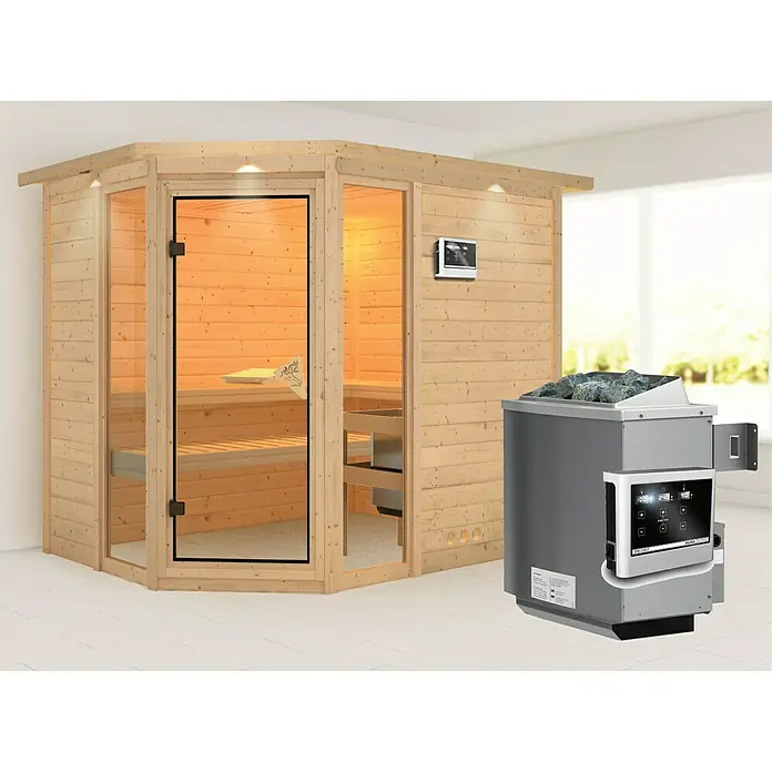 Karibu Massivholzsauna Sinai 3 - Mit 9 kW Ofen mit externer Steuerung, Mit Dachkranz und Beleuchtung, L x B x H: 264 x 198 x 200 cm - Das Bild zeigt eine Holzsauna mit Glastür und einen grauen Saunaofen mit Steinen.  Das moderne Design fügt sich nahtlos in jeden Wellnessbereich ein.