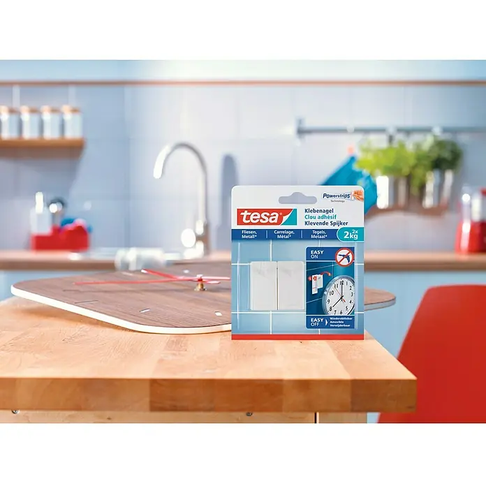 Tesa Clavo adhesivo - Blanco, Carga soportada: 2 kg, 2 ud., Azulejos - Clavo adhesivo Tesa en enfoque: Una solución innovadora para montar en azulejos y superficies metálicas, soportando hasta 2 kg. Fácil de aplicar y quitar.