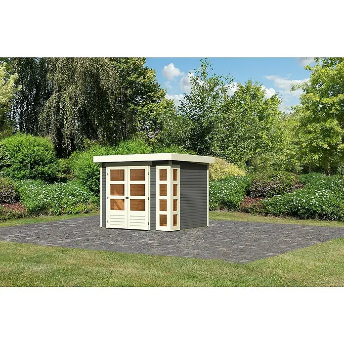 Karibu Gartenhaus Kerko 3Außenmaß inkl. Dachüberstand (B x T): 266 x 238 cm, Holz, Terragrau - Ein modernes Gartenhaus mit Doppeltür und Seitenfenster in Grau und Weiß, umgeben von Grün. Der ideale Stauraum für Ihren Garten.