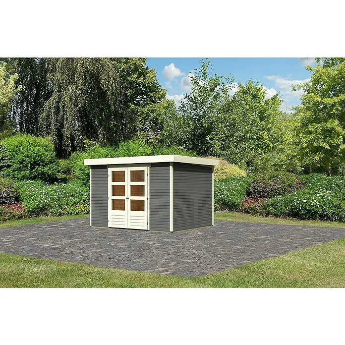 Karibu Gartenhaus Askola 5 - Außenmaß inkl. Dachüberstand (B x T): 330 x 262 cm, Holz, Terragrau, Ohne Seitendach - Ein graues Gartenhaus mit Doppeltür und weißen Rahmen auf einer gepflasterten Fläche, umgeben von Grün. Ideal zur Aufbewahrung von Gartengeräten.
