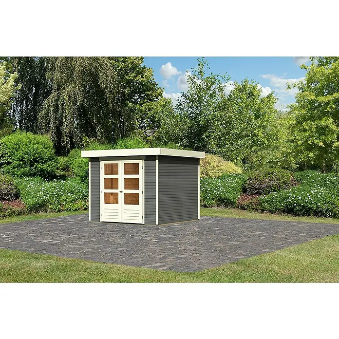 Karibu Gartenhaus Cuno 3 - Außenmaß inkl. Dachüberstand (B x T): 266 x 238 cm, Holz, Terragrau - Ein modernes Gartenhaus mit Doppeltür auf einer gepflasterten Fläche, umgeben von üppigem Grün. Das Haus ist grau mit weißen Akzenten.