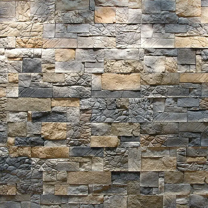 Revestimiento de piedra Montblanc Otoño - Cantidad total: 4 pzs. - Primer plano de una pared con revestimientos de piedra decorativos en varios tonos de gris y marrón, creando un aspecto rústico.