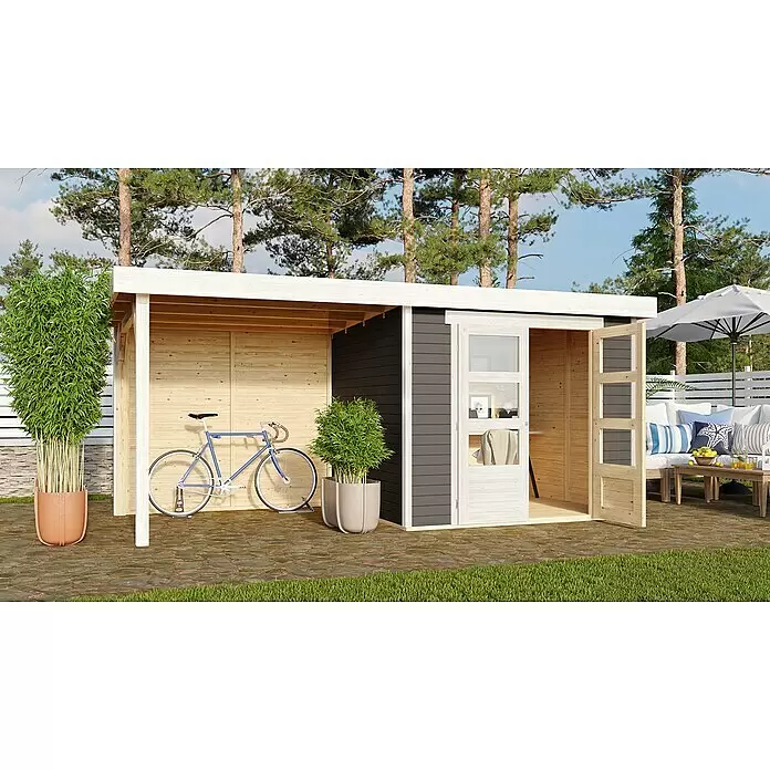 Karibu Gartenhaus Askola 3 - Außenmaß inkl. Dachüberstand (B x T): 491 x 238 cm, Holz, Terragrau, Mit Seitendach und Rückwand - Modernes Gartenhaus aus Holz mit offenem Vordach, dunkelgrauen und naturfarbenen Holzpaneelen, auf einer Steinterrasse.