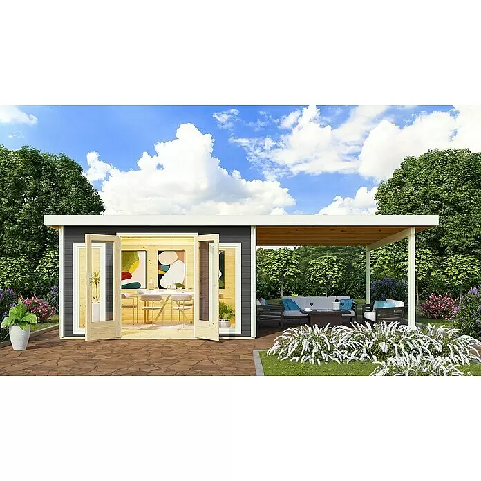 Karibu Gartenhaus Radeburg 3 - Außenmaß inkl. Dachüberstand (B x T): 724 x 393 cm, Holz, Terragrau, Mit Seitendach - Ein dunkelgraues Gartenhaus mit hellen Holztüren, verbunden mit einer Holzpergola mit weißen Pfosten, in einem üppigen Garten.