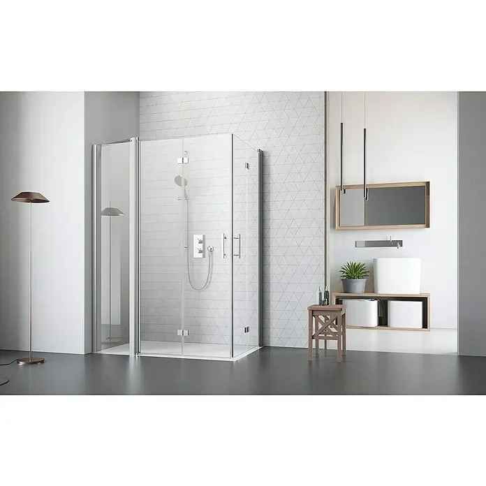 Camargue Vario Eckdusche S53+S16+S53 - 90 x 150 x 200 cm, Beschichtet, Silber, Glasstärke: 6 mm - Ein modernes Badezimmer mit einer stilvollen, gläsernen Duschkabine, einem Spiegel und einem Waschtisch mit Pflanze. Die Bodenleuchte rundet das Bild ab.