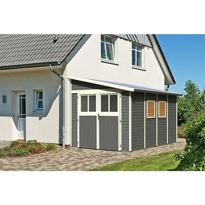 Karibu Gartenhaus Bomlitz 4 - Außenmaß inkl. Dachüberstand (B x T): 255 x 388 cm, Holz, Terragrau - Bild einer stilvollen, dunkelgrauen Gerätehütte mit Doppeltür und kleinem Vordach, die an ein Wohnhaus angebaut ist.