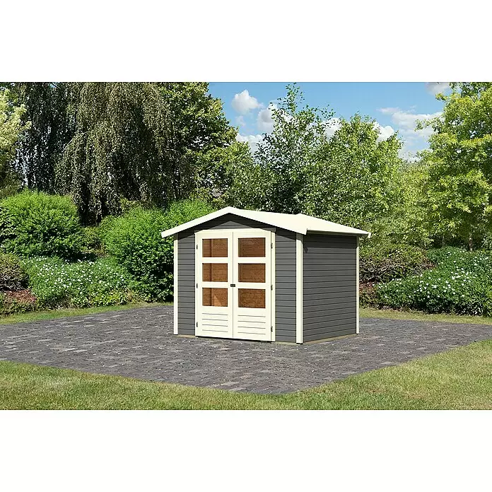 Karibu Gartenhaus Amberg 3 - Außenmaß inkl. Dachüberstand (B x T): 272 x 210 cm, Holz, Terragrau - Dunkelgraues Gartenhaus mit cremefarbenen Akzenten und Doppeltüren mit Fenstern, auf einer gepflasterten Terrasse im Garten.