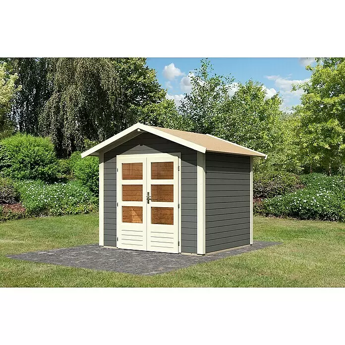 Karibu Gartenhaus Talkau 3 - Außenmaß inkl. Dachüberstand (B x T): 270 x 234 cm, Holz, Terragrau - Dunkelgraues Holzgartenhaus mit hellen Türen und Zierleisten, auf einem gepflasterten Fundament.