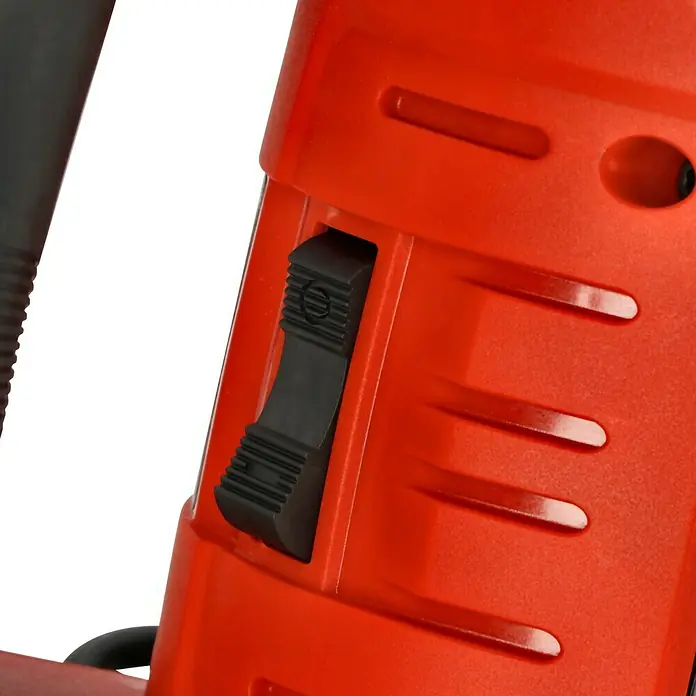 Einhell Professional Martillo demoledor TE-DH 50 - 1.700 W, 50 J, Alojamiento SDS-Hex - Primer plano de una herramienta eléctrica roja con interruptor negro.