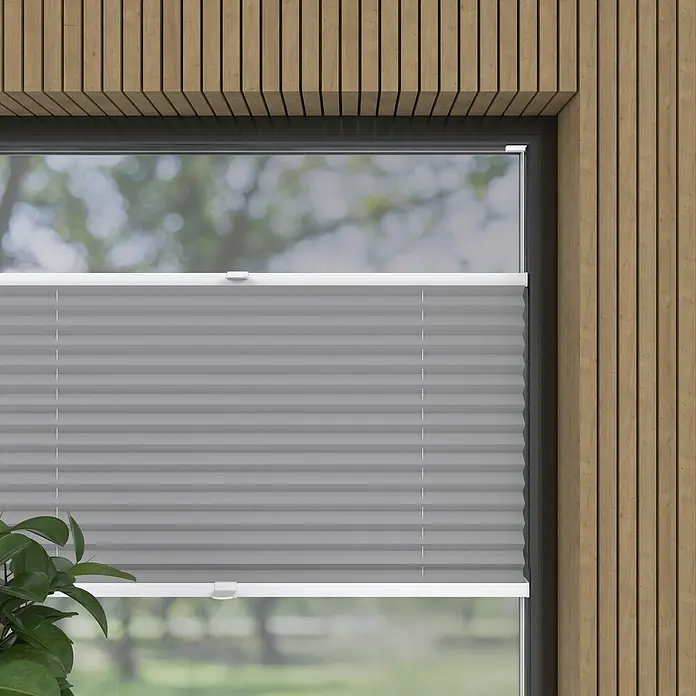 Expo Ambiente Plissee Thermo - B x H: 50 x 130 cm, Grau - Nahaufnahme einer grauen Plissee-Jalousie in einem Fenster, die eine elegante und funktionelle Fensterdekoration zeigt.