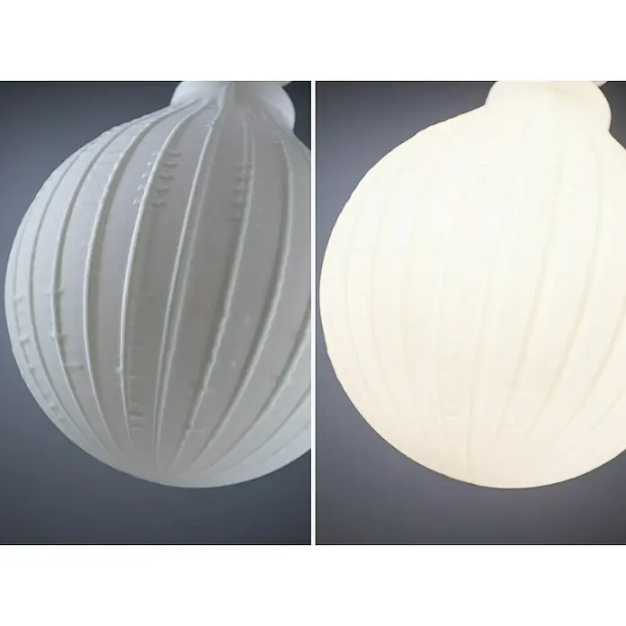 Paulmann LED-Lampe White Lampion Filament gestreift - E27, Dimmbar, Warmweiß, 400 lm, 4 W - Nahaufnahme einer weißen dekorativen Kugel mit gerippter Textur, die ein elegantes und schlichtes Design präsentiert.