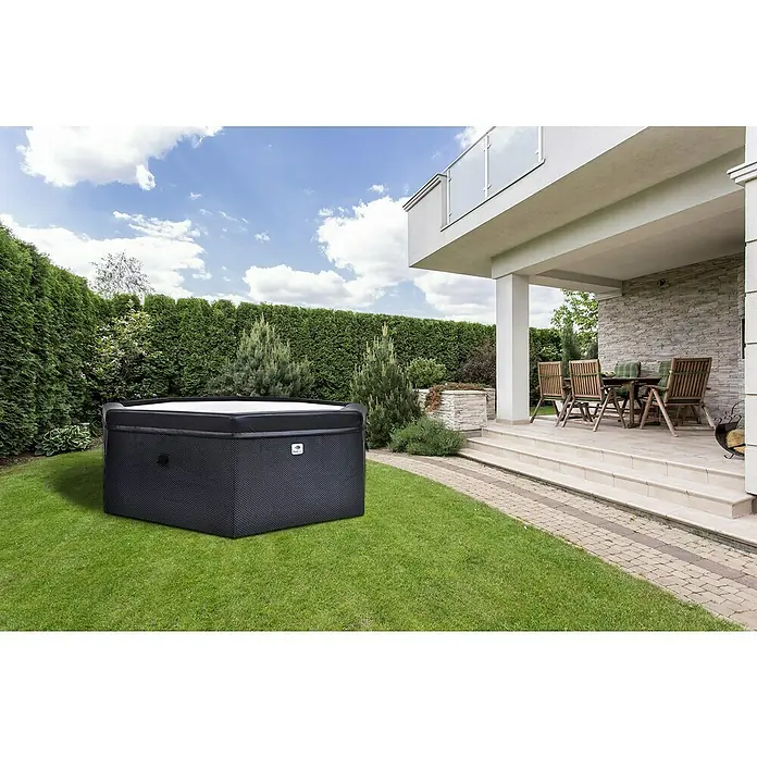 GardWell Mobil-Whirlpool Unos - Ø x H: 193 x 70 cm, Anthrazit/Innen Weiß, 1.000 l - Ein schwarzer, tragbarer Whirlpool im Garten neben einer Terrasse. Ideal zum Entspannen im Freien und für stilvolle Gartengestaltung.