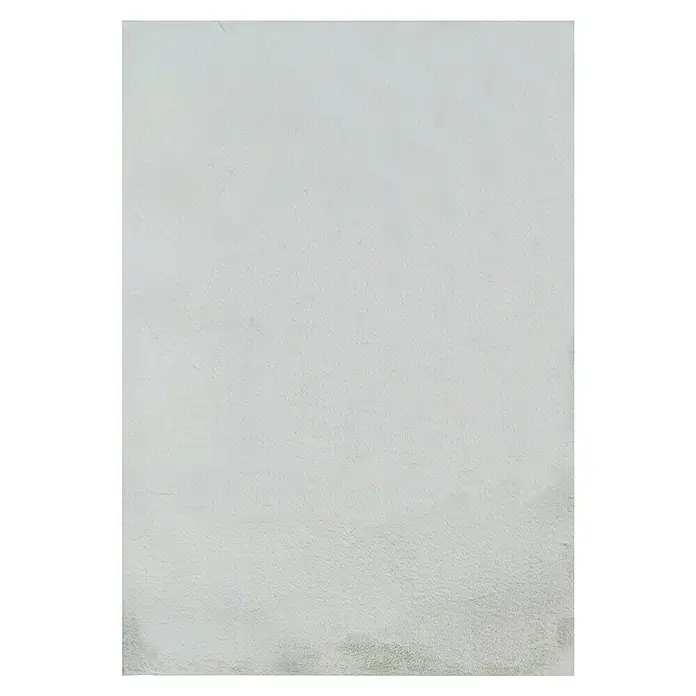 Alfombra de pelo corto Tiana - Crudo, 110 x 60 cm - Primer plano de una superficie gris texturizada, ideal para fondos y diseños abstractos.