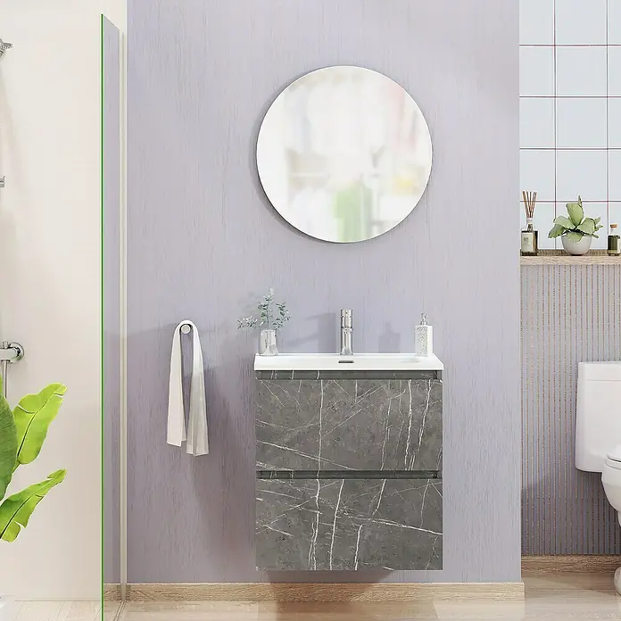 Artysan Conjunto de mueble de baño Kira - Ancho: 60 cm, Gris Piedra, 3 pzs. - Imagen de un baño moderno con un tocador de mármol gris, un espejo redondo y un inodoro blanco.