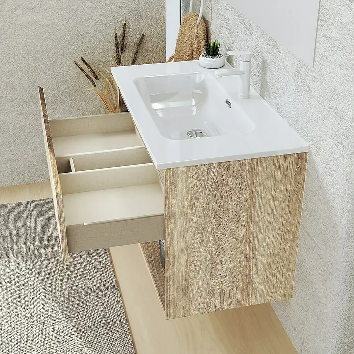 Artysan Conjunto de mueble de baño Vela - Ancho: 60 cm, Natural, 3 pzs. - Un mueble de baño de aspecto madera con un cajón abierto que muestra los compartimentos interiores.