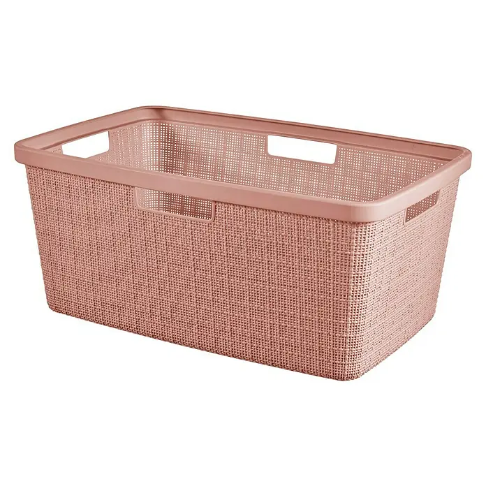 Curver Wäschekorb Jute - L x B x H: 59,4 x 39,4 x 25,6 cm, Rosa - Aufnahme eines rosa Wäschekorbs mit gewebter Textur und rechteckigen Griffen. Er ist leer und bereit für Wäsche.