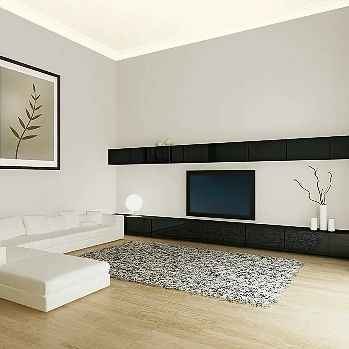 swingcolor Soft Colors Wandfarbe - Stone, Matt, 5 l - Wohnzimmer mit weißem Sofa, TV-Wand und abstraktem Teppich. Das moderne Design strahlt Eleganz und Minimalismus aus, perfekt für stilvolles Wohnen.