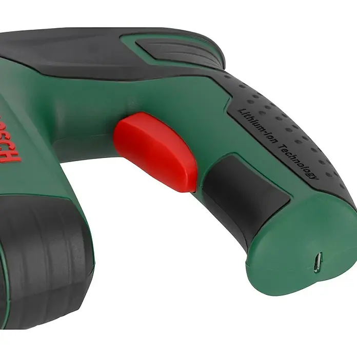 Bosch Akku-Tacker PTK 3,6 LI - 3,6 V, 1 Akku, 1,5 Ah, Klammertiefe: 4 mm - 10 mm - Nahaufnahme eines Akku-Werkzeugs mit grünen und schwarzen Elementen, hervorgehoben durch einen roten Knopf und der Aufschrift "Lithium-Ion Technology".