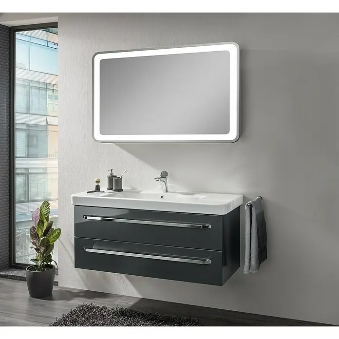 Lanzet K2 Waschtischunterschrank - 117,9 x 45,3 x 48,9 cm, Grafit - Elegantes Badezimmer-Ensemble mit einem grauen Waschtischunterschrank mit zwei Schubladen, einem weißen Waschbecken und einem beleuchteten Spiegel.