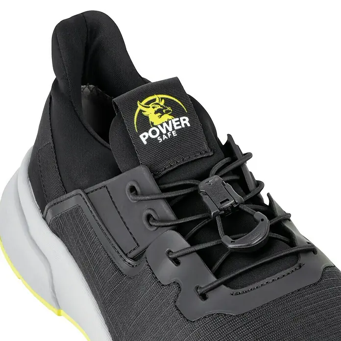 Sicherheitsschuhe AdamSchuhgröße: 45, S1P - Nahaufnahme eines schwarzen Power Safe-Schuhs mit gelbem Logo.