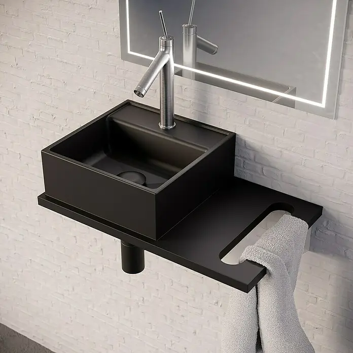 Lavabo pequeño con encimera y sifón Libera Space - An x L: 45 x 30 cm, Negro - Primer plano de un moderno lavabo negro con toallero y espejo. El diseño elegante es ideal para baños modernos.
