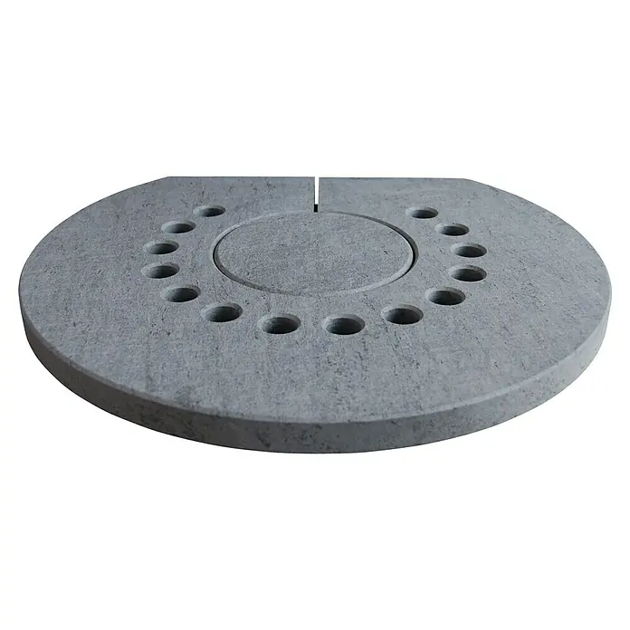 Aduro Abdeckplatte Speckstein - Passend für: Kaminofen Aduro 9, L x B x H: 490 x 447 x 30 mm, Aus Speckstein gefertigt - Detailaufnahme einer grauen runden Beton-Feuerstelle mit kreisförmig angeordneten Löchern, die für ein gemütliches Ambiente sorgt.