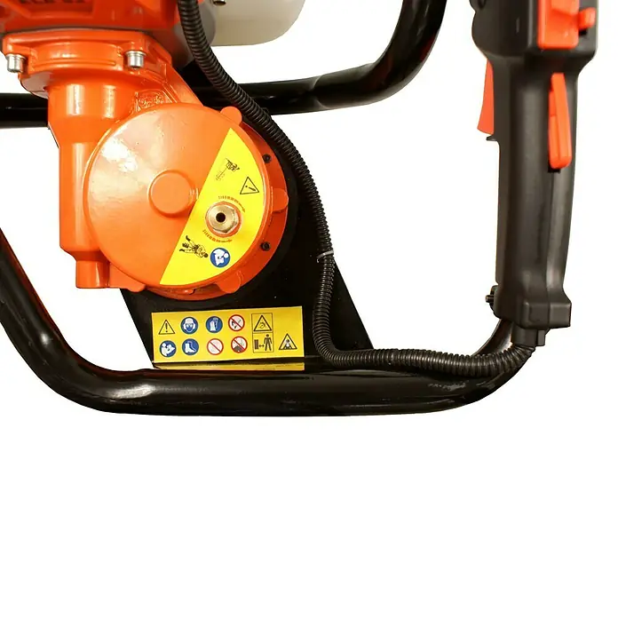 Atika Erdlochbohrer ELB 52 - 2,2 kW - Nahaufnahme einer orangefarbenen Erdlochbohrmaschine mit Warnhinweisen auf einem gelben Etikett.