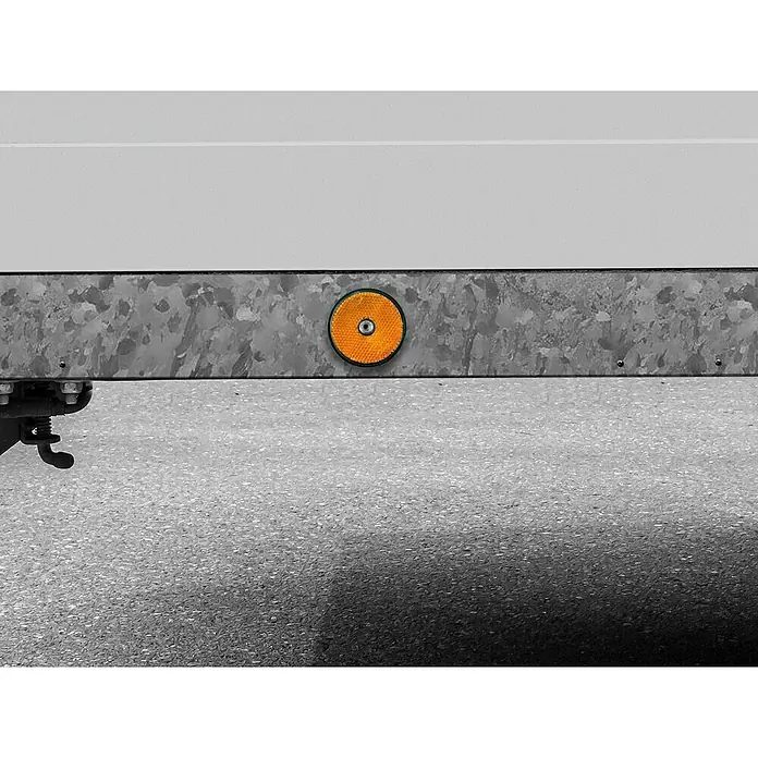 LAS Reflektor - 2 Stk., Orange - Nahaufnahme eines Anhängers mit einem runden, orangefarbenen Reflektor an der Seite, der die Sichtbarkeit erhöht.