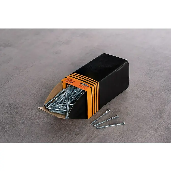 Eurotec Justierschraube Justitec - Ø x L: 6 x 80 mm, TX für TORX-Antriebe, 200 Stk. - Eine offene Schachtel mit Eurotec-Holzschrauben 6,0 x 80 mm liegt auf einer grauen Oberfläche, wobei einige Schrauben aus der Schachtel gefallen sind.