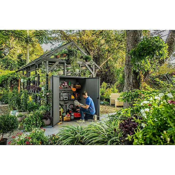Keter Armario de jardín Cortina Alto - Medidas ext. (An x Pr): 140 x 73,6 cm, Plástico, Antracita - Este cobertizo espacioso ofrece amplio espacio para herramientas y equipos de jardinería. Ideal para almacenamiento al aire libre.